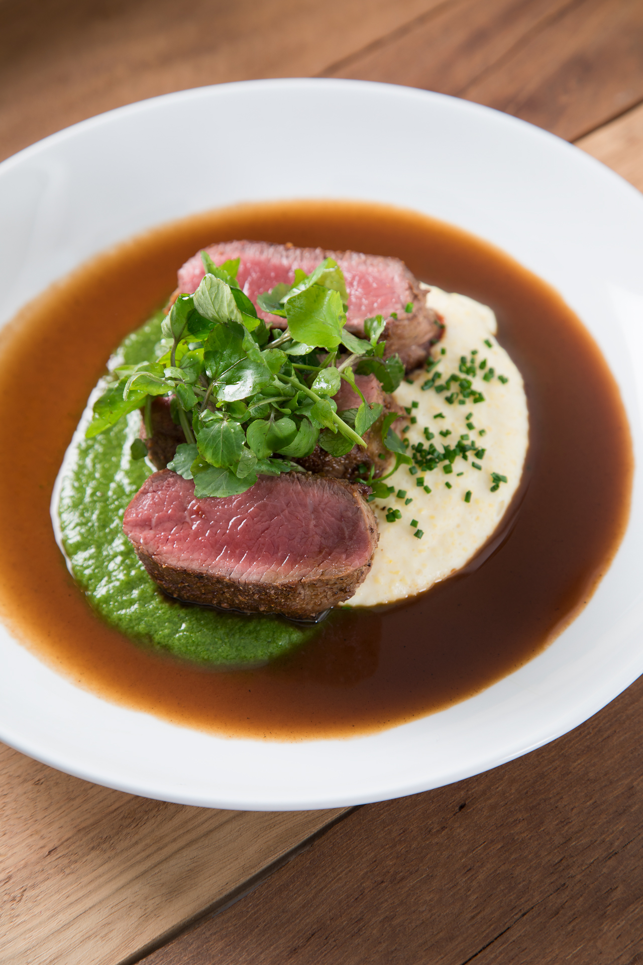 Lamb medallions with watercress puree and polenta